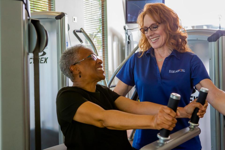 Woman Resident working with Physical therapist at Eskaton Village Roseville Onsite Gym