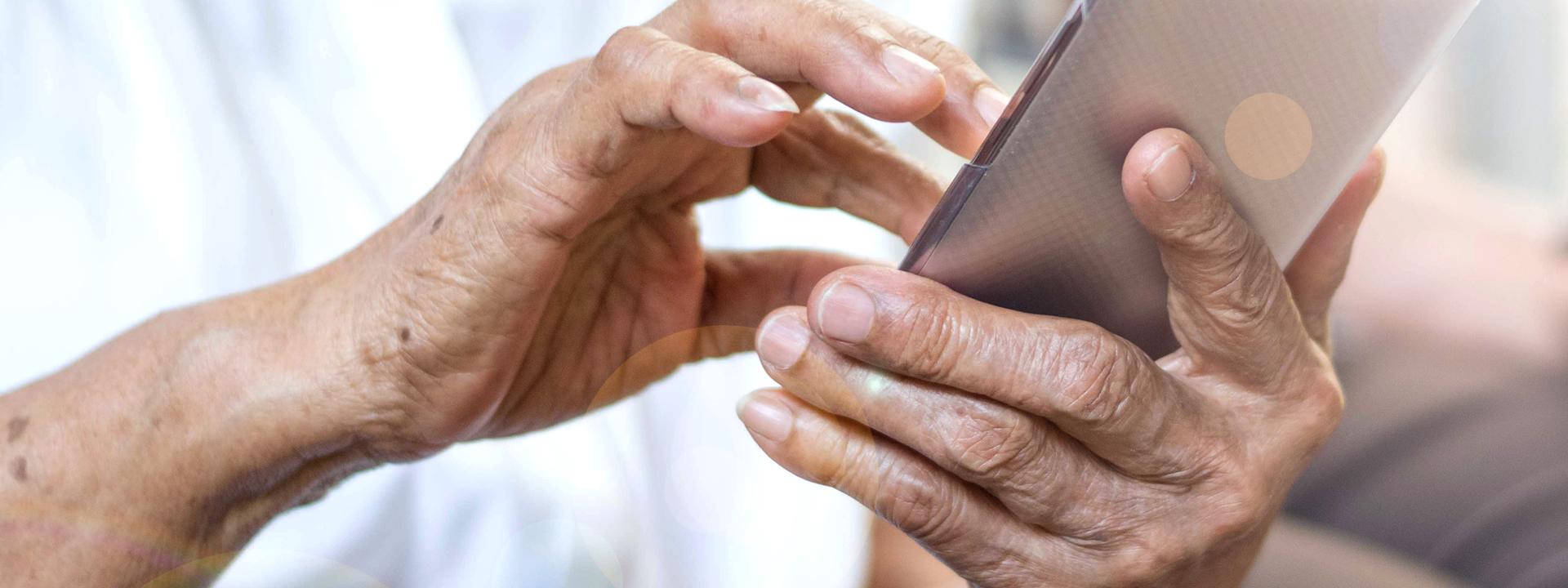 A resident using his iPad to access the apps for Eskaton Connect system.