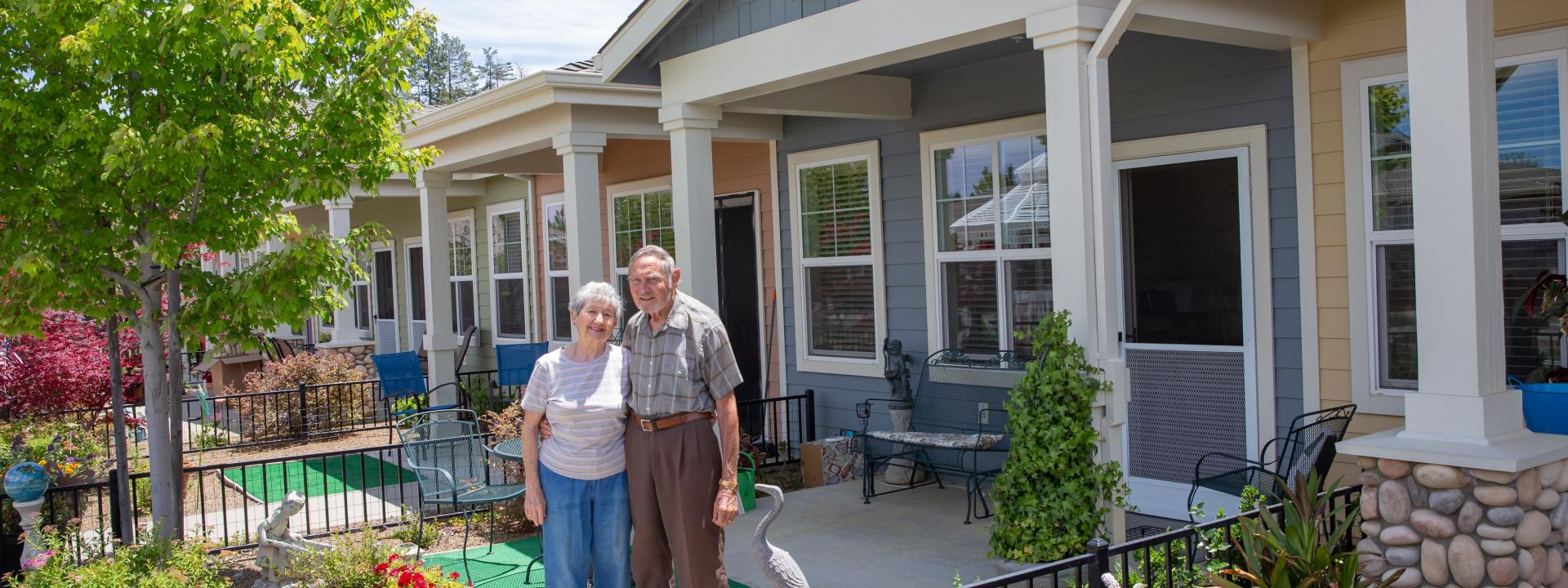 Smiling couples outside in front of their patio home