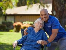 Outside, residents and staff are smiling and laughing.