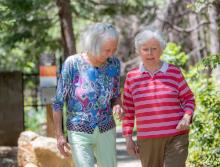 Residents walking along the beautiful walking trail at Eskaton Village Grass Valley.