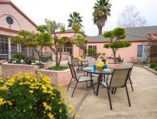 Community outside patio with table and chair