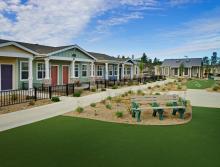 Village Placerville cottages and community outdoor area with benches