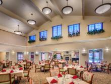 Eskaton Village Roseville's  dining room with all tables beautiful set.