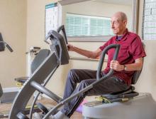 Male resident exercising at the community gym