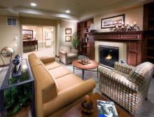 Common area living room with couch, chairs and fireplace