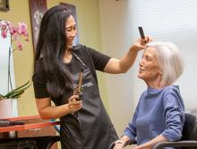 A woman resident getting her hair done in the community's salon.