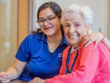 Smiling resident and staff