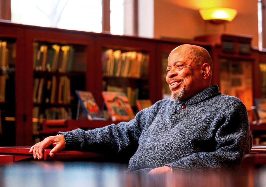 Judge Rudolph "Barry" Loncke sitting in a library smiling.