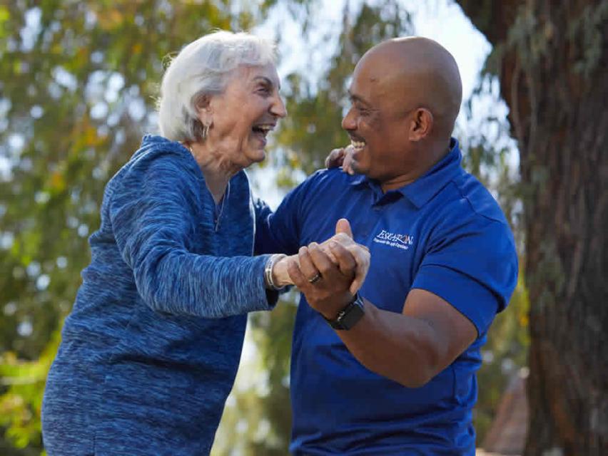 Resident Bonnie smiling and dancing with Jon