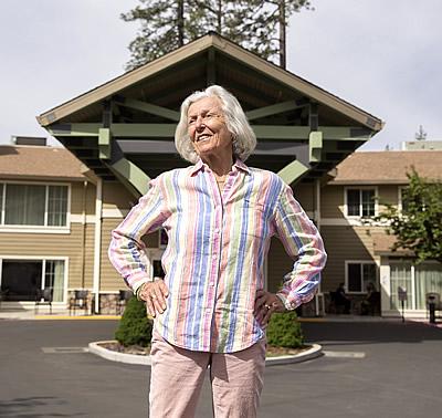 Inge standing in front of Eskaton Village Grass Valley entrance