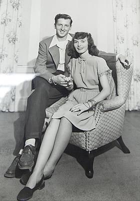 Joyce and her husband Bob sitting on a chair together