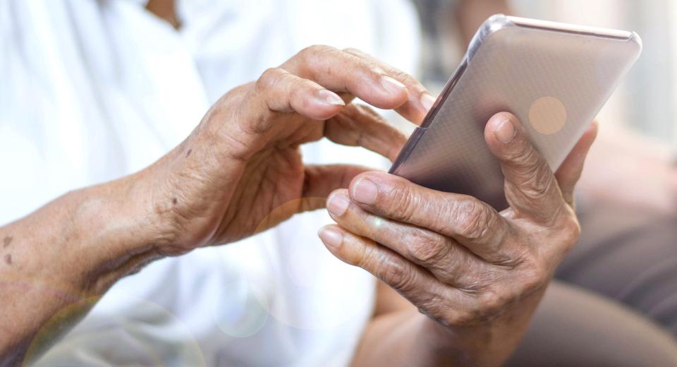 A resident using his iPad to access the apps for Eskaton Connect system.