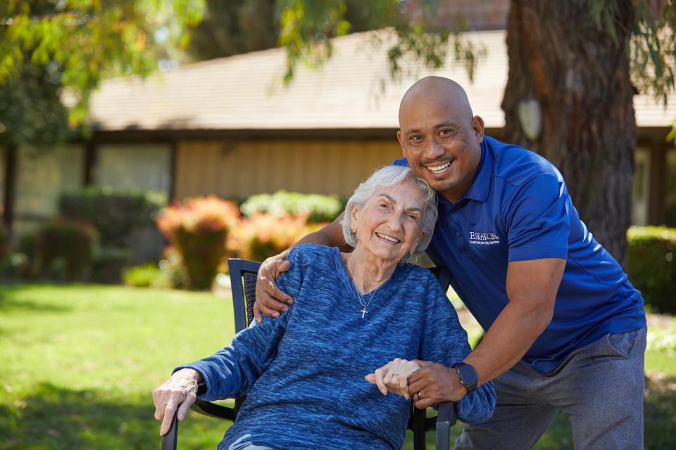 Outside, residents and staff are smiling and laughing.