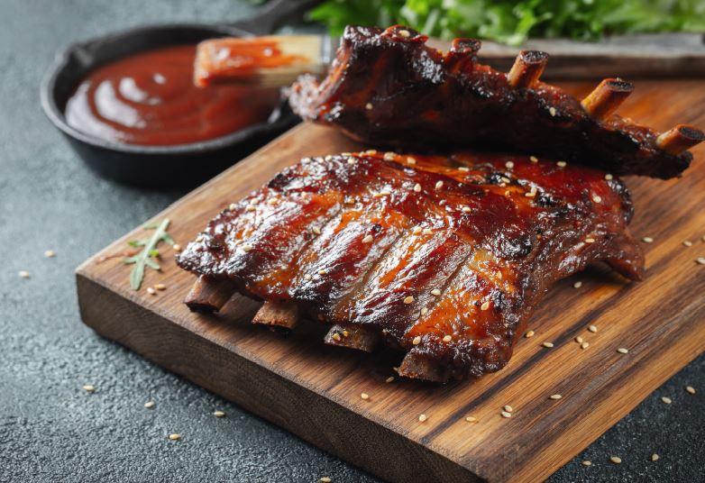 Barbecue Ribs and a bowel of BBQ sauce
