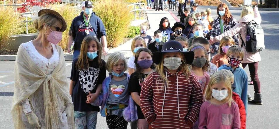 Several kids visiting Eskaton Village Grass Valley for their 20th anniversary.