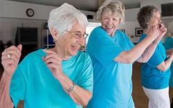 Three ladies enjoying an exercise class