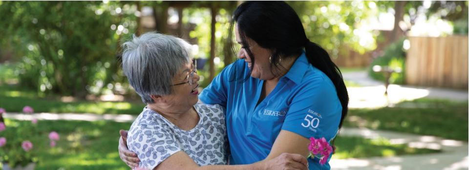 Resident and her guardian angel hugging