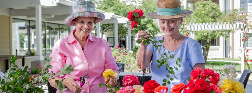 Two Woman Gardening Flowers