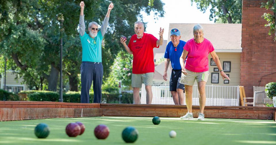Resident playing a game of bocce ball