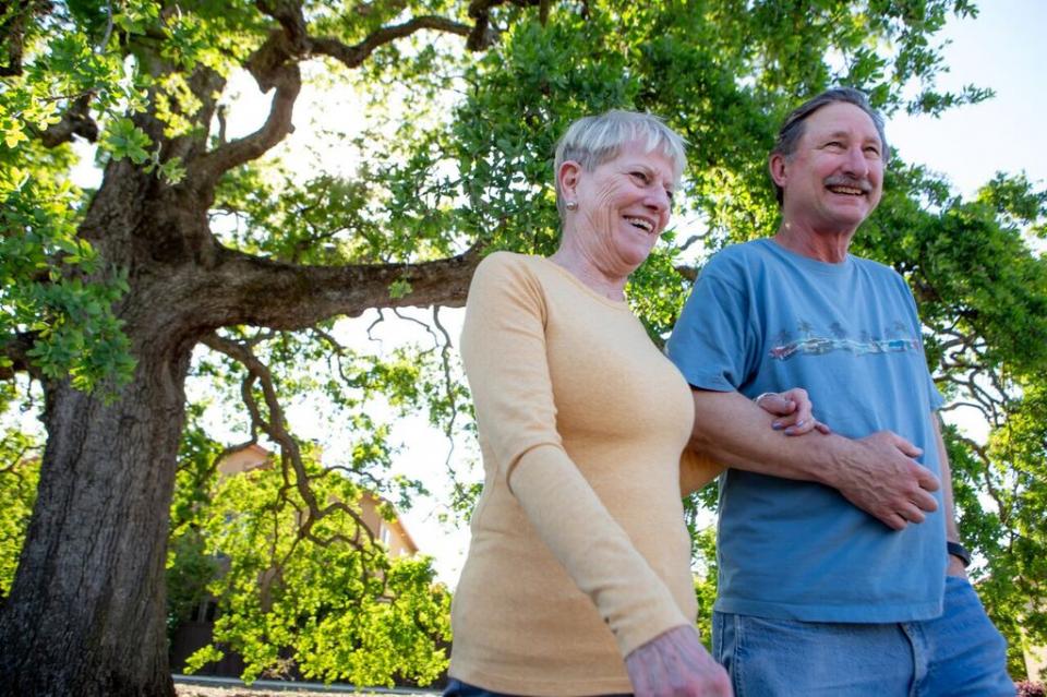 A happy couple taking a walk, arm-in-arm