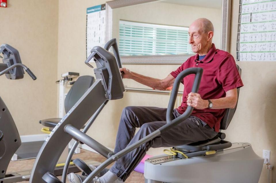 Male resident exercising at the community gym
