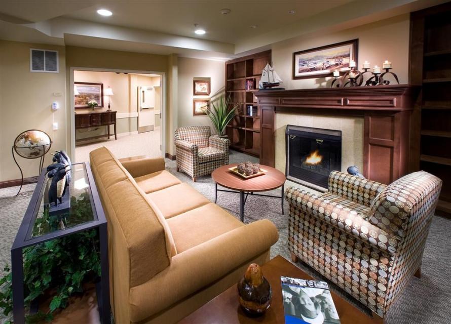 Common area living room with couch, chairs and fireplace