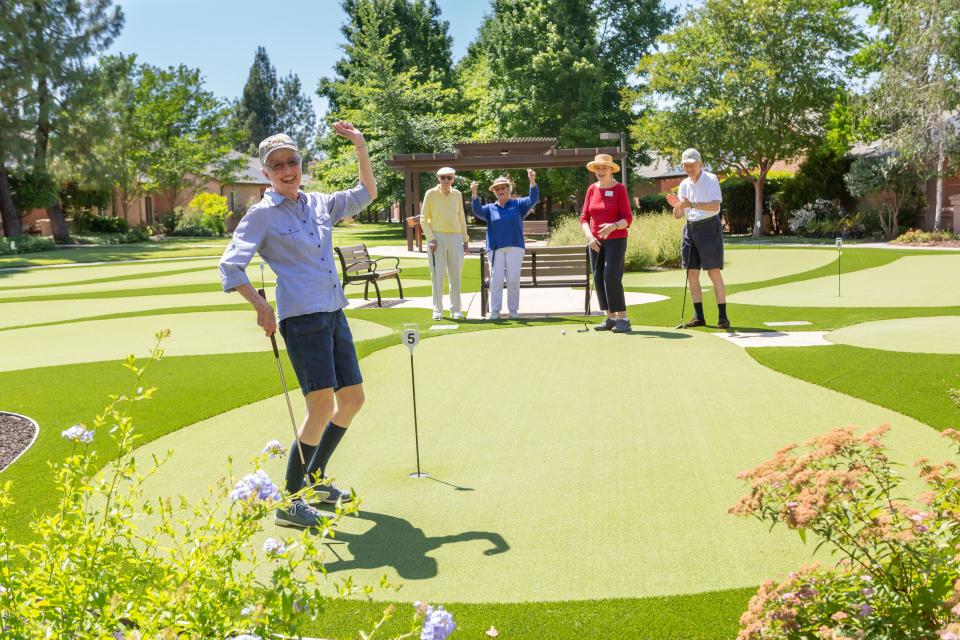Residents enjoying a sunny day on the putting greens at Eskaton Village Carmichael