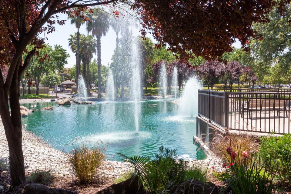 Continuing Care Retirement Community CCRC Sacramento - Beautiful Eskaton Village Carmichael with pond, fountains, and outdoor deck