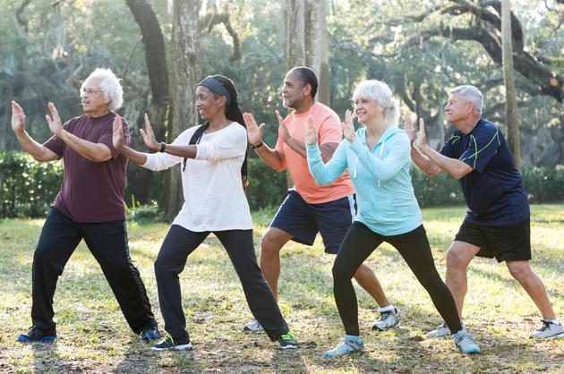 A group of residents doing Tai Chi exercises.