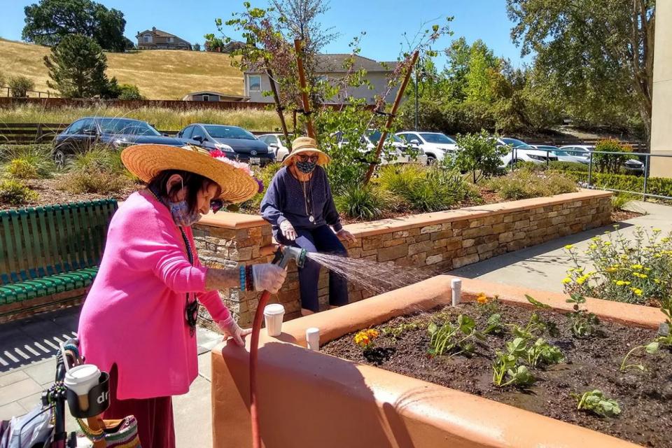 TRC-residents-gardening-in-the-Deborah-L-Lind-Memorial-Garden