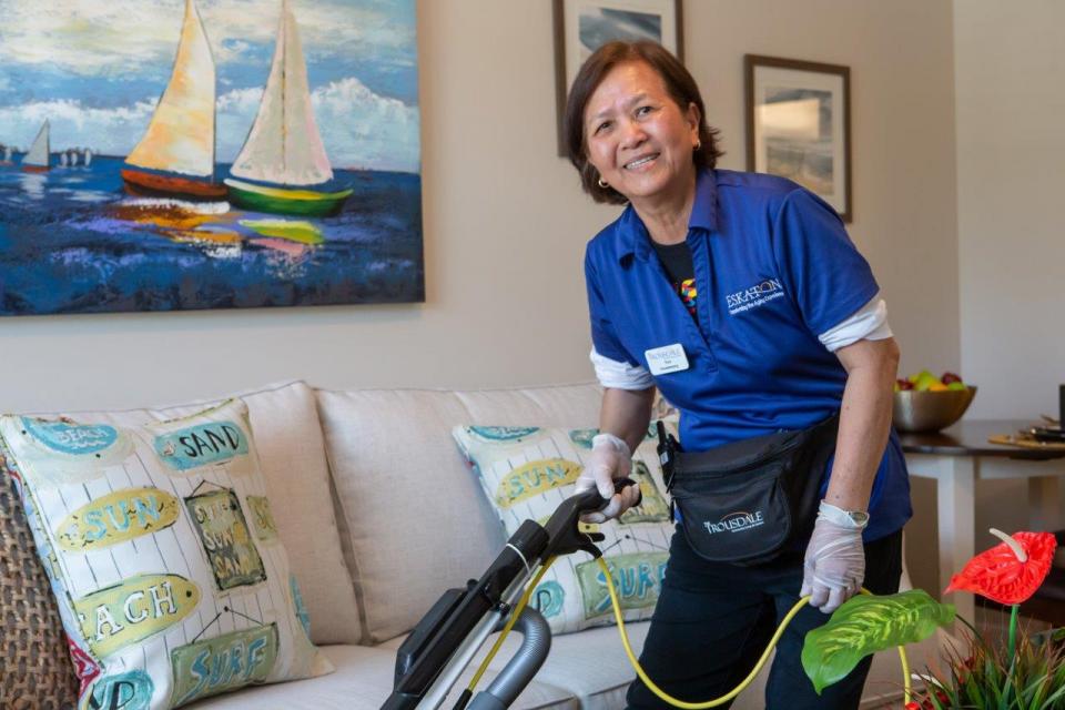  Housekeeping staff vacuuming an apartment