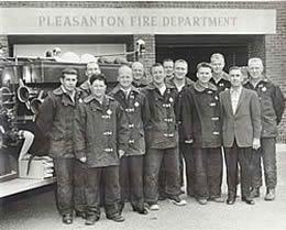 Resident Bob Juniper in his younger years standing in front of the Pleasanton Fire Department with all his fellow firemen.