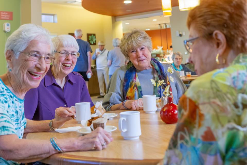 A group of friends socializing at the Village Bistro