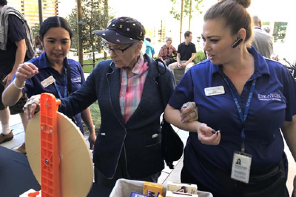 Residents enjoying activities on the outside patio