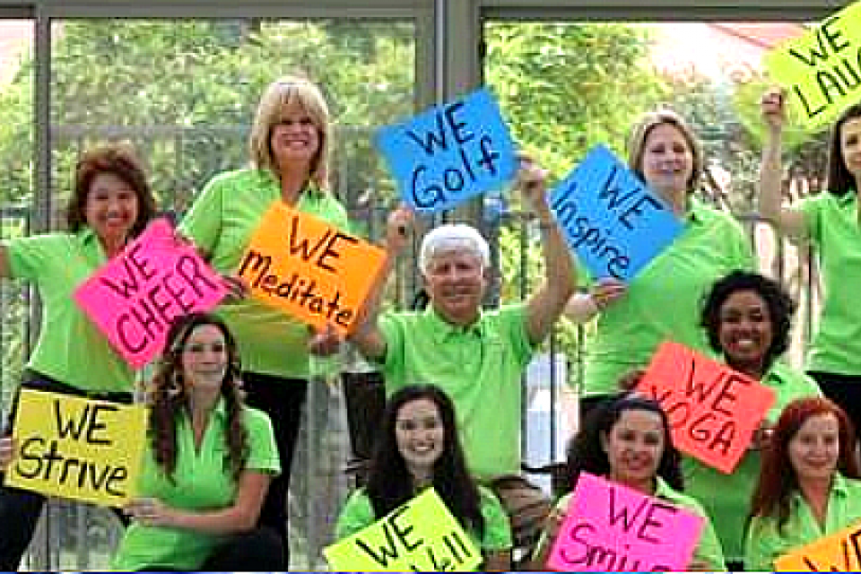Eskaton employees holding up signs of all types of activities (i.e. We Golf; We Walk, etc.)