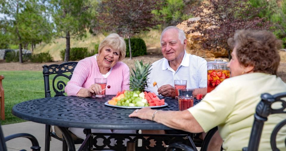 Friends visiting outside on patio