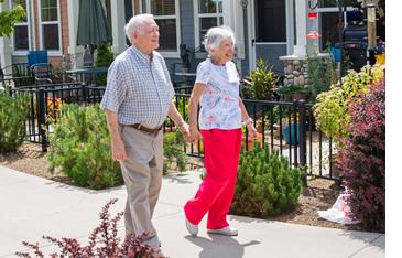A couple taking a walk, holding hands