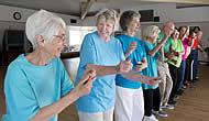 Several residents in a fall prevention fitness class